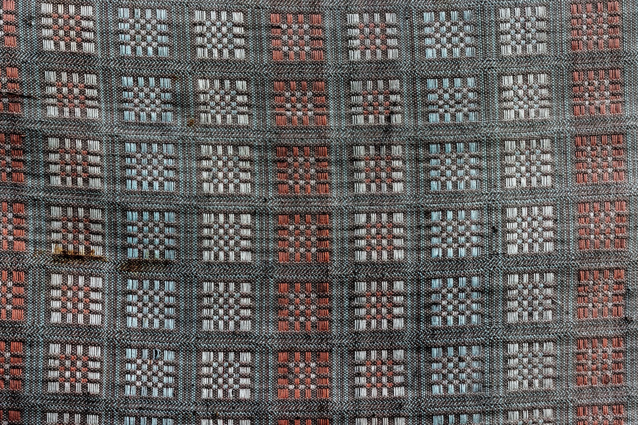 Woven textile detail in earthy tones